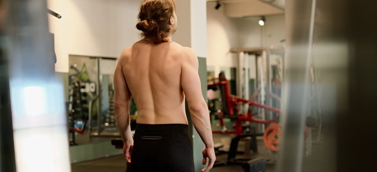 A fit man working out in a gym, highlighting exercise and fitness lifestyle.